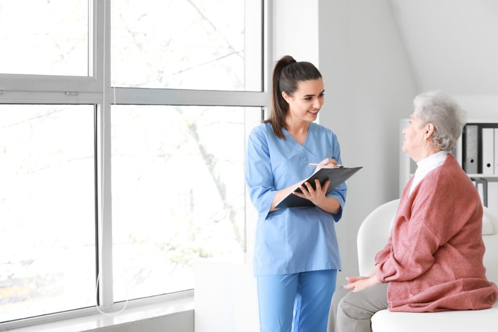 medical worker examining senior woman in nursing home medical worker examining senior woman in nursing home